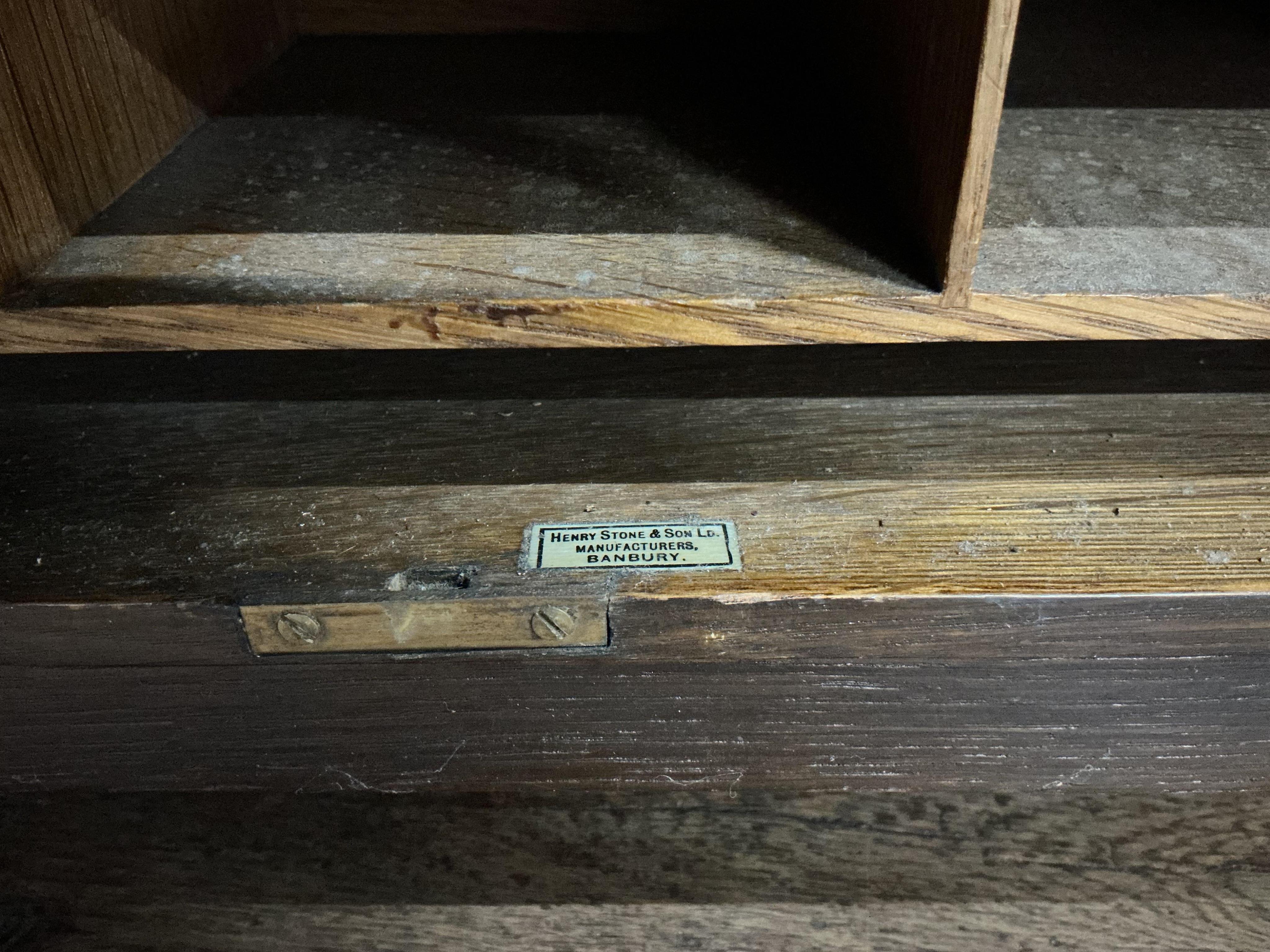 An Edwardian oak stationery cabinet, width 57cm, depth 29cm, height 72cm